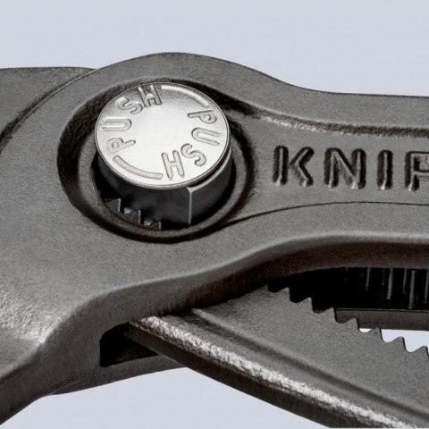 KNIPEX 87 02 180 – samozaciskowe szczypce do rur i nakrętek, długość 180 mm.